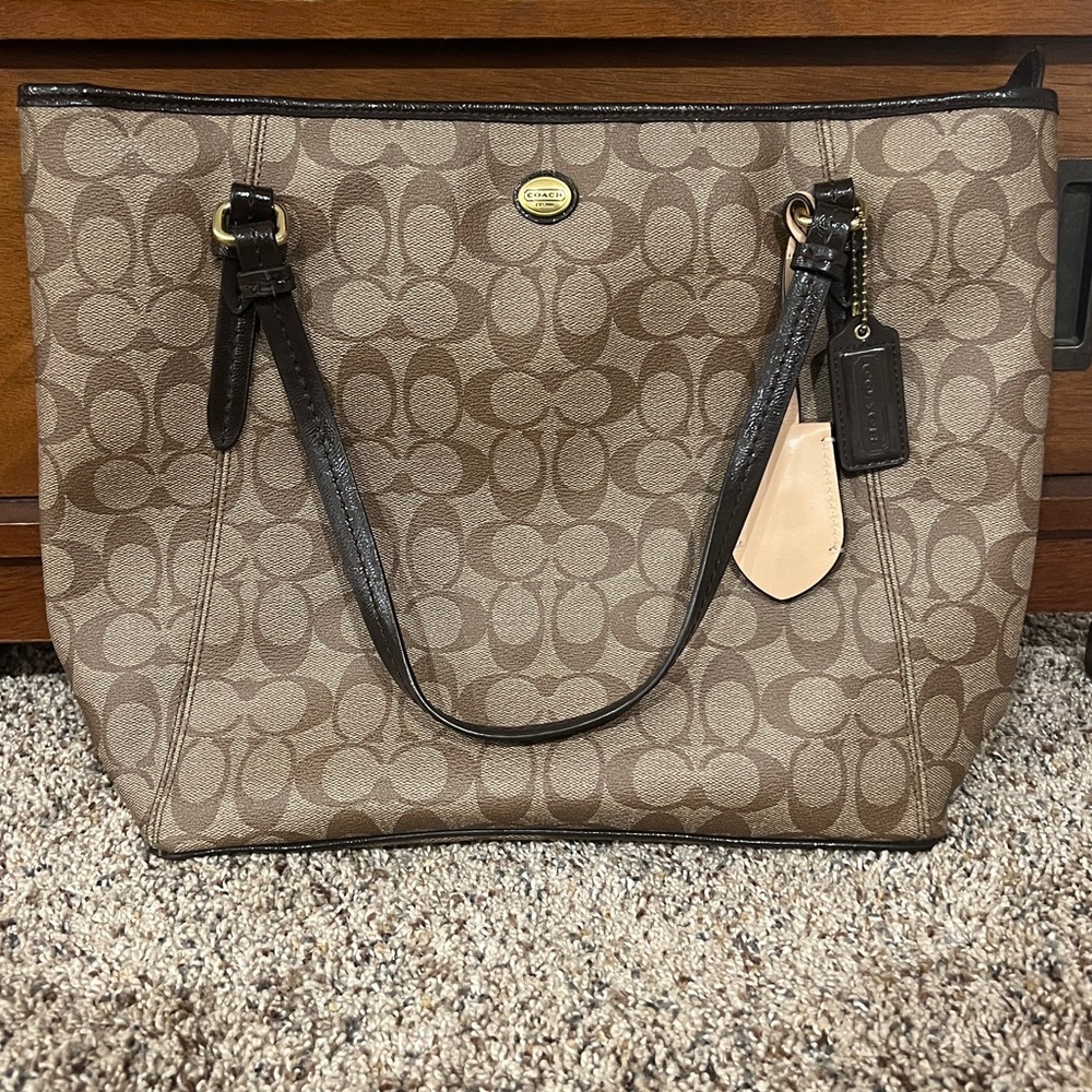 Authentic coach handbag. Zipper pouch inside & couple of smaller pouches within